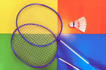 badminton racquet on a colored background