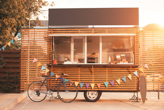 Food truck with bicycle during sunset