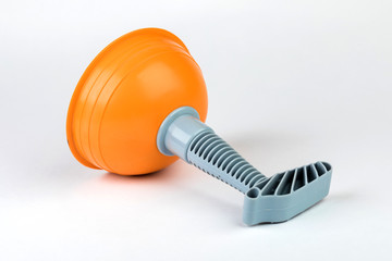 Plunger (plunger) orange for cleaning toilet on white background.