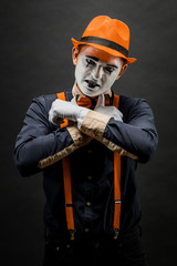 Fototapeta premium Frightened male mime, isolated on black. Lively emotions of an actor performing a pantomime
