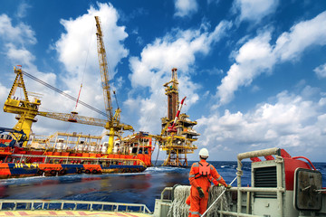 Technician or worker on the crew boat during transfer to platform or drilling rig  in process oil...