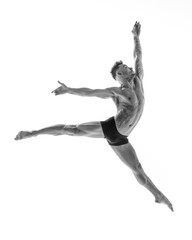 Obraz premium Young beautiful dancer is posing in studio