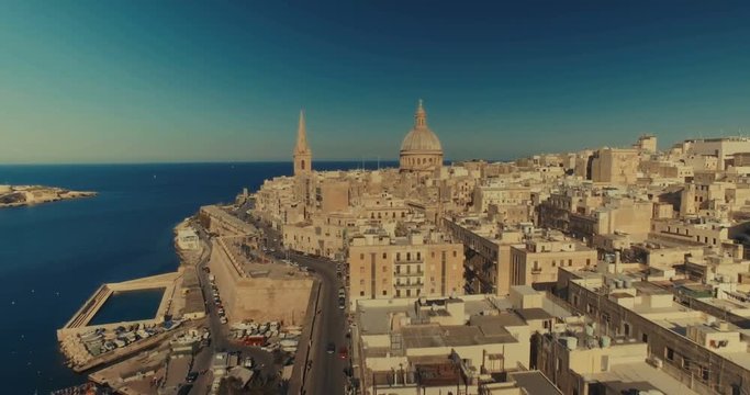 Aerial shot over Valletta moving towards the Basilica of Mount Carmel