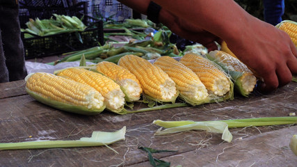 Fried and boiled corn. A seller of fast food at a flea market in Turkey.