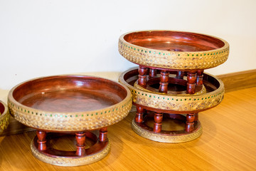 The shelves are made of beautiful wood. Put it in the back of the room