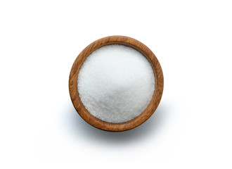 Sugar in a wooden cup top view isolated on white