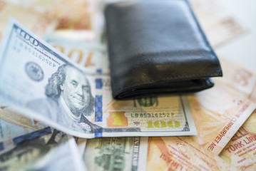 money background with american dollars and turkish liras, hundred dollars and fifty turkish liras background. random moneys, economic and financial crisis and wallet