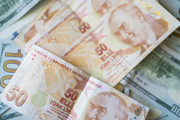 money background with american dollars and turkish liras, hundred dollars and fifty turkish liras background. random moneys, economic and financial crisis