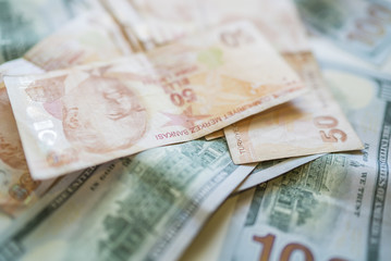 money background with american dollars and turkish liras, hundred dollars and fifty turkish liras background. random moneys, economic and financial crisis