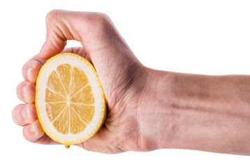 Hand squeezing half of lemon
