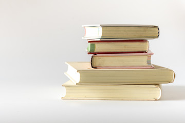 Stack of old books isolated on white background. 