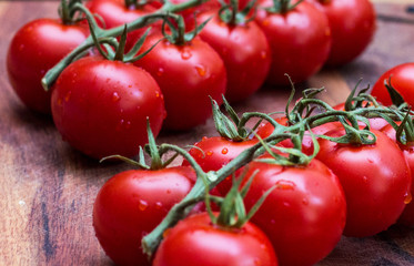 small tomatoes, sherry on a wooden board.