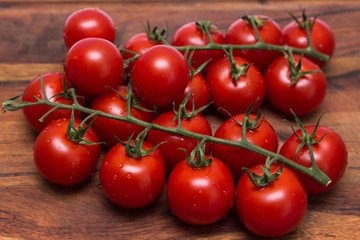 small tomatoes, sherry on a wooden board.