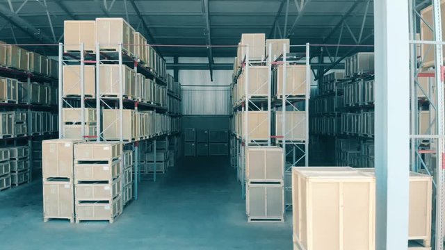 New racks with boxes in an open warehouse.