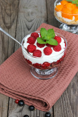 Dessert cups of Pecheneg, cottage cheese, raspberry, and apricot