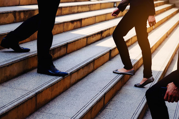 crowd of young business people team walking fast up and down stairs going to work time at morning...