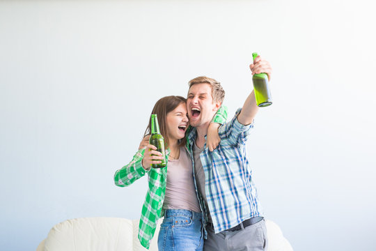 Soccer world cup concept - Modern couple looking excited and happy watching sport game on tv