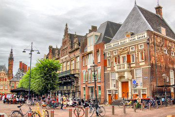 HAARLEM, NETHERLANDS - JULY 09, 2018 : Historical houses in old Haarlem. Typical Dutch architecture.