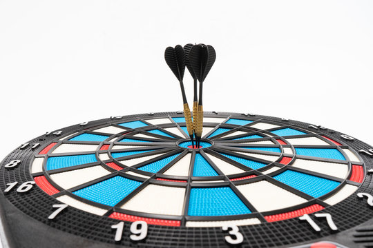 dart arraw and dartboard target on white background