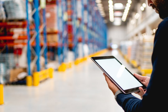 Manager In Warehouse Holding Digital Tablet