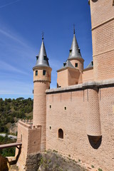 Fototapeta premium Two Battlements Of The Main Facade Of The Alcazar Castle In Segovia. Architecture, Travel, History. June 18, 2018. Segovia Castilla Leon Spain.