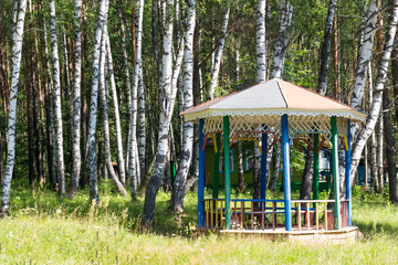 gazebo in the summer forest