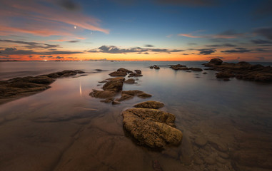 view of beautiful sunset seascape at Kudat, Sabah Malaysia. soft focus due to long expose.