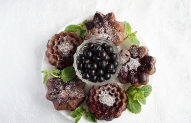 muffin and currant berries on white background