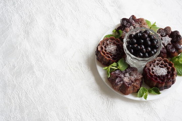 muffin and currant berries on white background