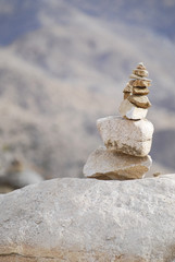 Fototapeta na wymiar Stone cairn, beautiful pile of stones