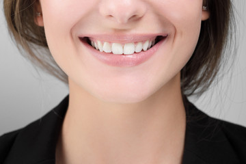 Closeup of woman smile with white healthy teeth