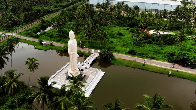 Aerial view from shot Peraliya Buddha Statue, the Tsunami Memorial in Hikkaduwa, Sri Lanka 4k