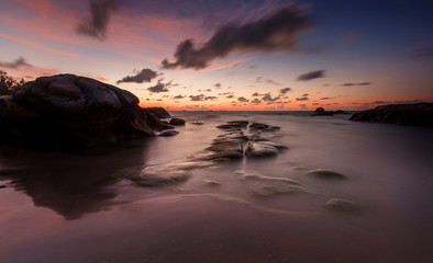 view of beautiful sunset seascape at Kudat, Sabah Malaysia. soft focus due to long expose.