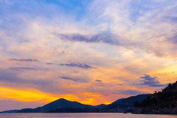 Awesome colorful sunset on the Adriatic sea coastline in Montenegro, gorgeous seascape