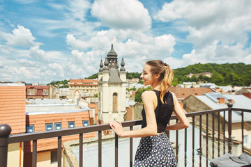 attractive happy smiling woman walking in the center of old city