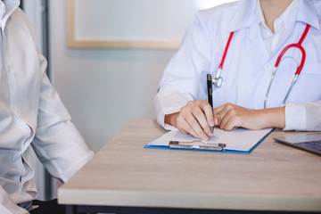 Female doctors and patients man to talk about healing. Consulting and treatment methods