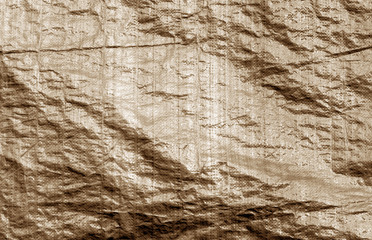 Plastic material uneven surface in brown color.