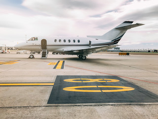 Private luxury jet at the airport terminal