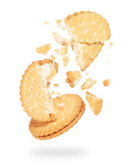 Tasty biscuit crushed into pieces close-up on a white background - obrazy, fototapety, plakaty