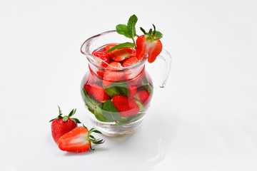 Summer fresh fruit flavored infused water of strawberry and mint. Space for test or design.