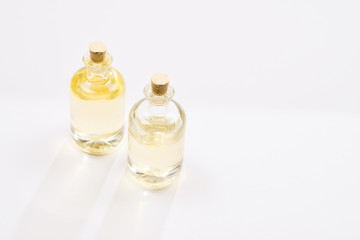 Natural oil in bottles on white background.