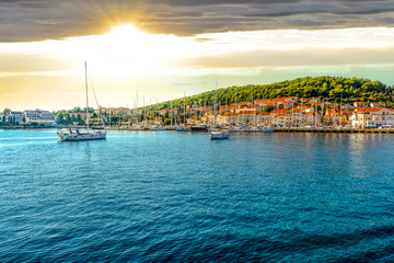 Boats in the harbor of the Croatian coastal city of Hvar, one of the many Islands near Dubrovnik and Korcula on the Dalmatian Coast of Croatia - obrazy, fototapety, plakaty