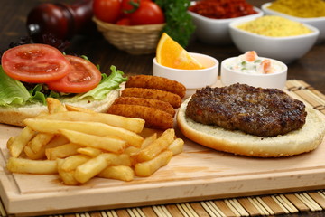 Open burger with lettuce leaves