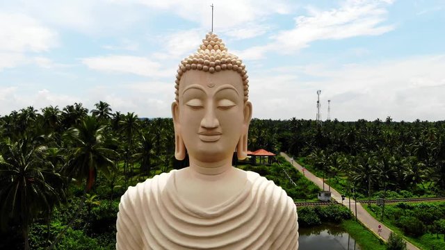 Aerial view from shot Peraliya Buddha Statue, the Tsunami Memorial in Hikkaduwa, Sri Lanka 4k