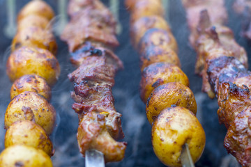 Barbecue kebab cooking. Grill potatoes dinner cook. Tasty food BBQ background. Roasted fresh beef meat