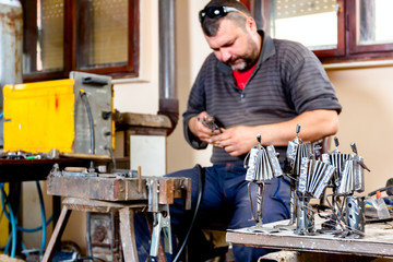 Figures of accordion, music performers made of welded metal wire