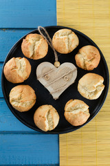 Biscuits with ricotta on black plate