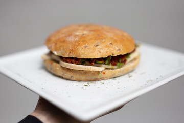 Healthy sandwich with chicken, tomatoes and pesto