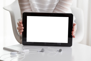 Woman holding a white screen tablet computer