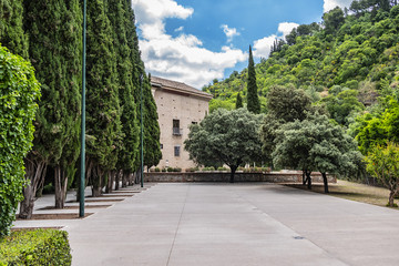 View of Palacio de los Cordova (now Historical Archive). Palace of Cordova was built at Placeta de las Descalzas around 1530 - 1592. Palace surrounded by beautiful gardens. Granada, Andalusia, Spain.